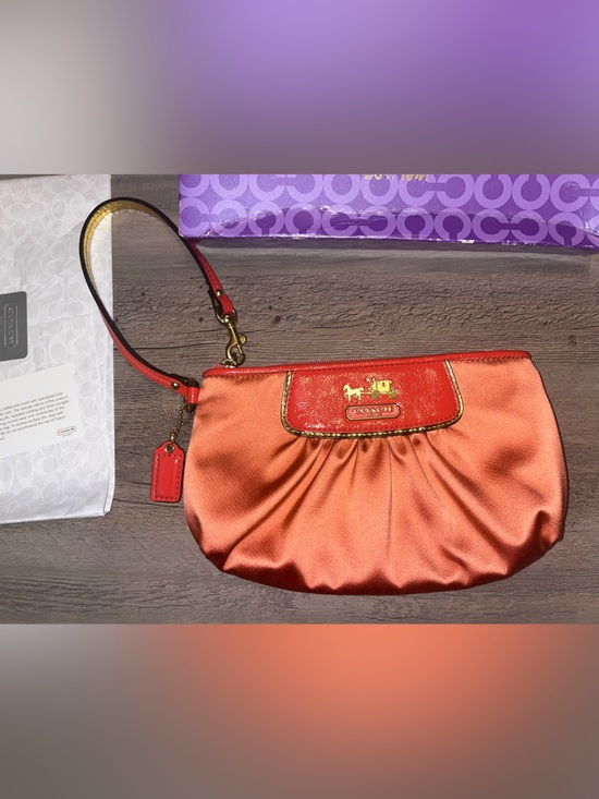 Coach Handbags - Coach Salmon oversized Satin Wristlet with Leather Trim and Gold Hardware